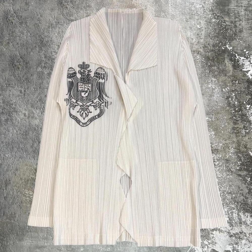 White and Black Issey Miyake Pleatse Please Cardigan. Issey Miyake Crest.